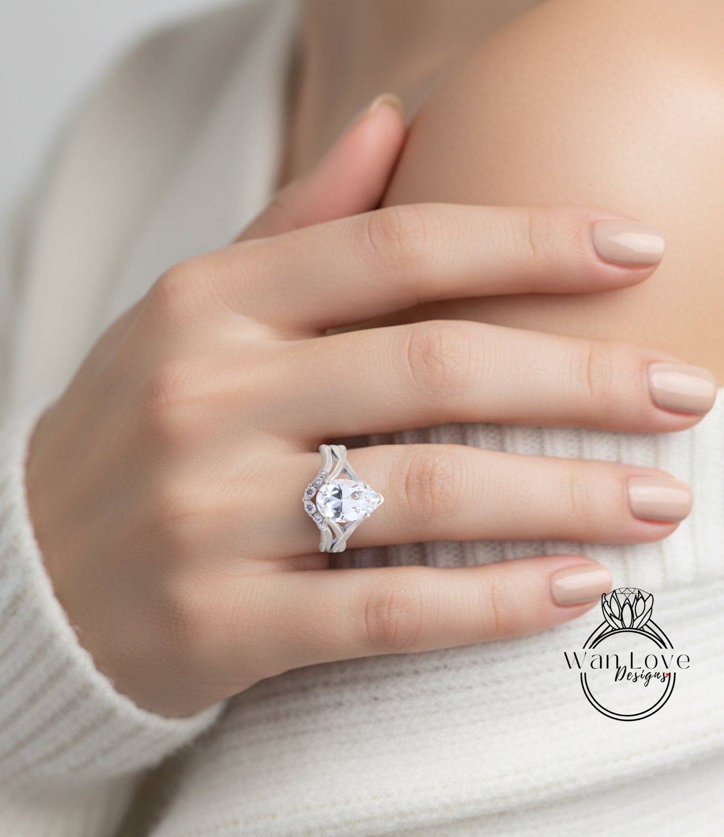 A close-up of a person's hand wearing a large diamond engagement ring.