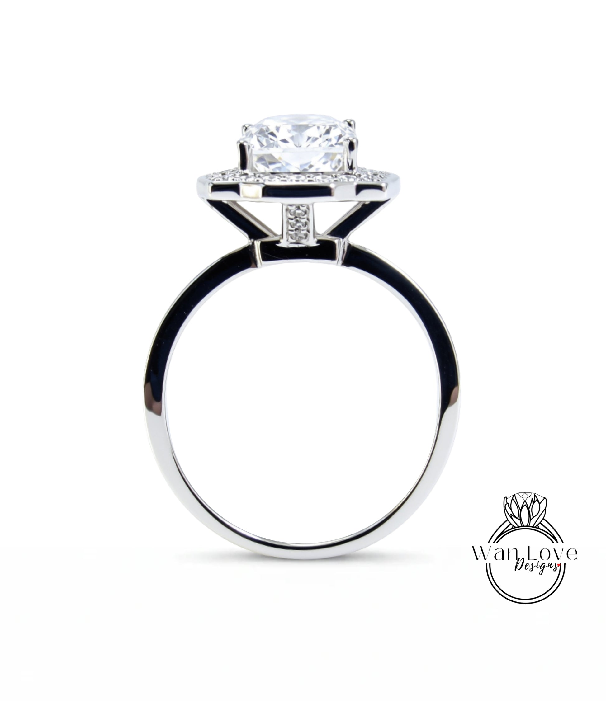 A silver ring with a large, clear gemstone set in the center, showcasing the intricate design and craftsmanship of the piece.