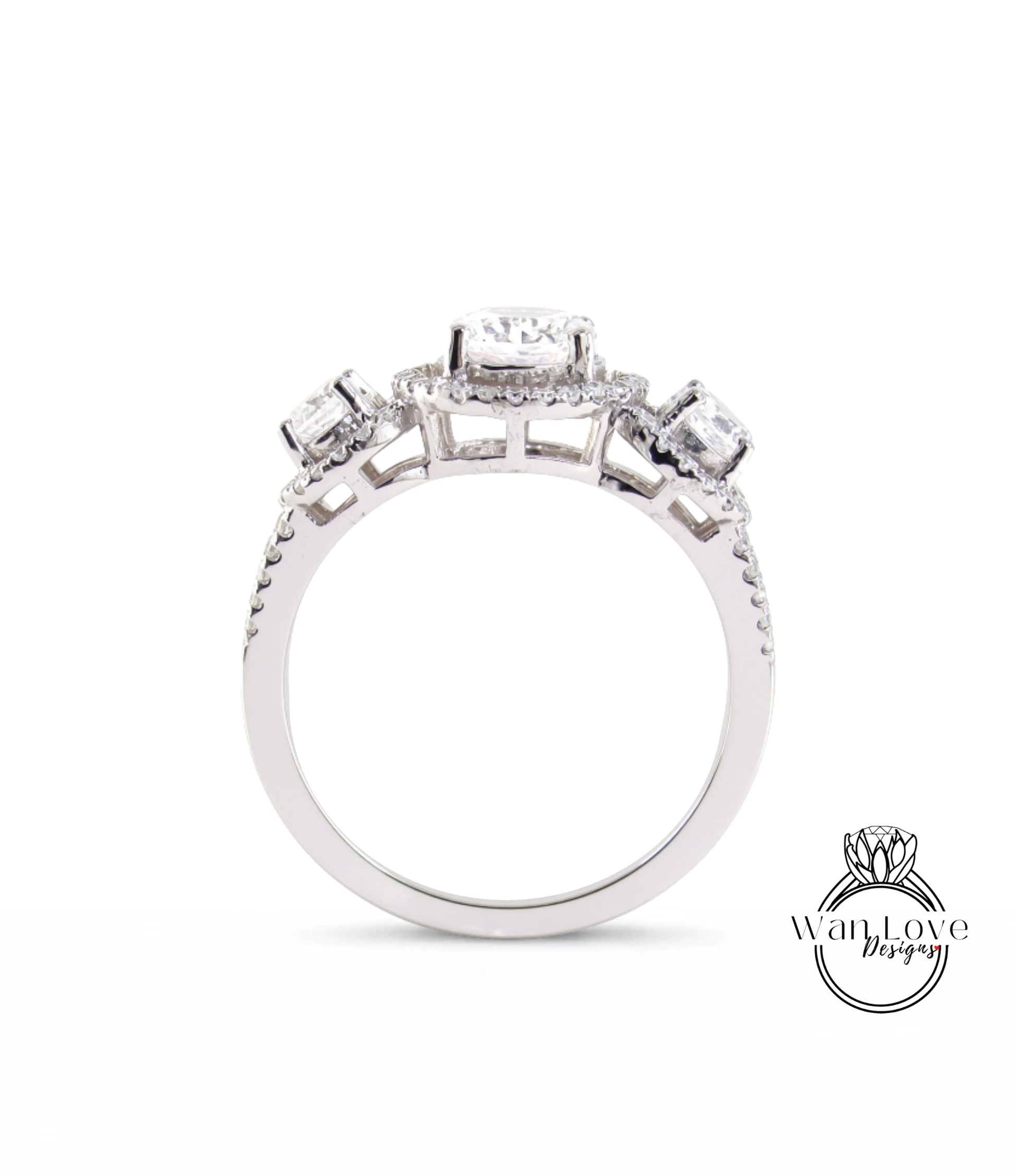 A silver engagement ring with a halo of diamonds set in the center.