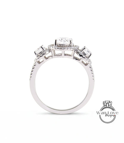 A silver engagement ring with a halo of diamonds set in the center.