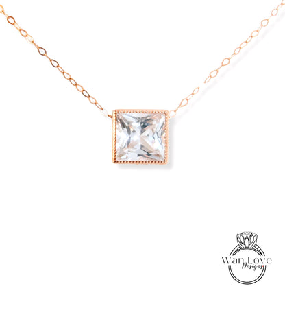 A necklace with a large, clear gemstone pendant in the center.