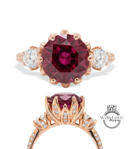 a beautiful engagement ring with a large, deep red gemstone surrounded by smaller diamonds. The ring is set in a rose gold band, and the image includes a close-up view of the ring's centerpiece and a side view of the ring's band.