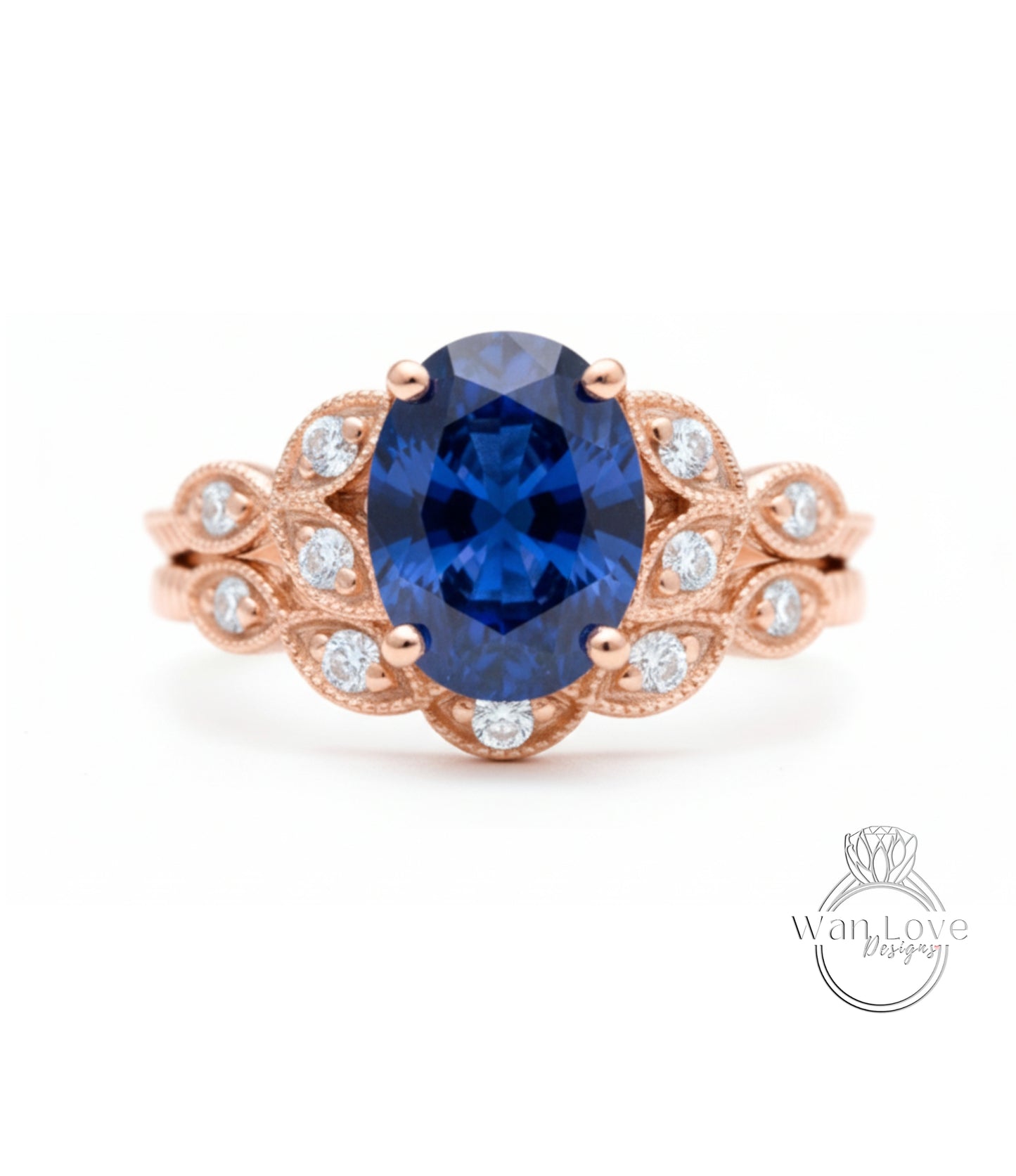 a beautiful blue sapphire engagement ring with a delicate rose gold band adorned with small diamonds.