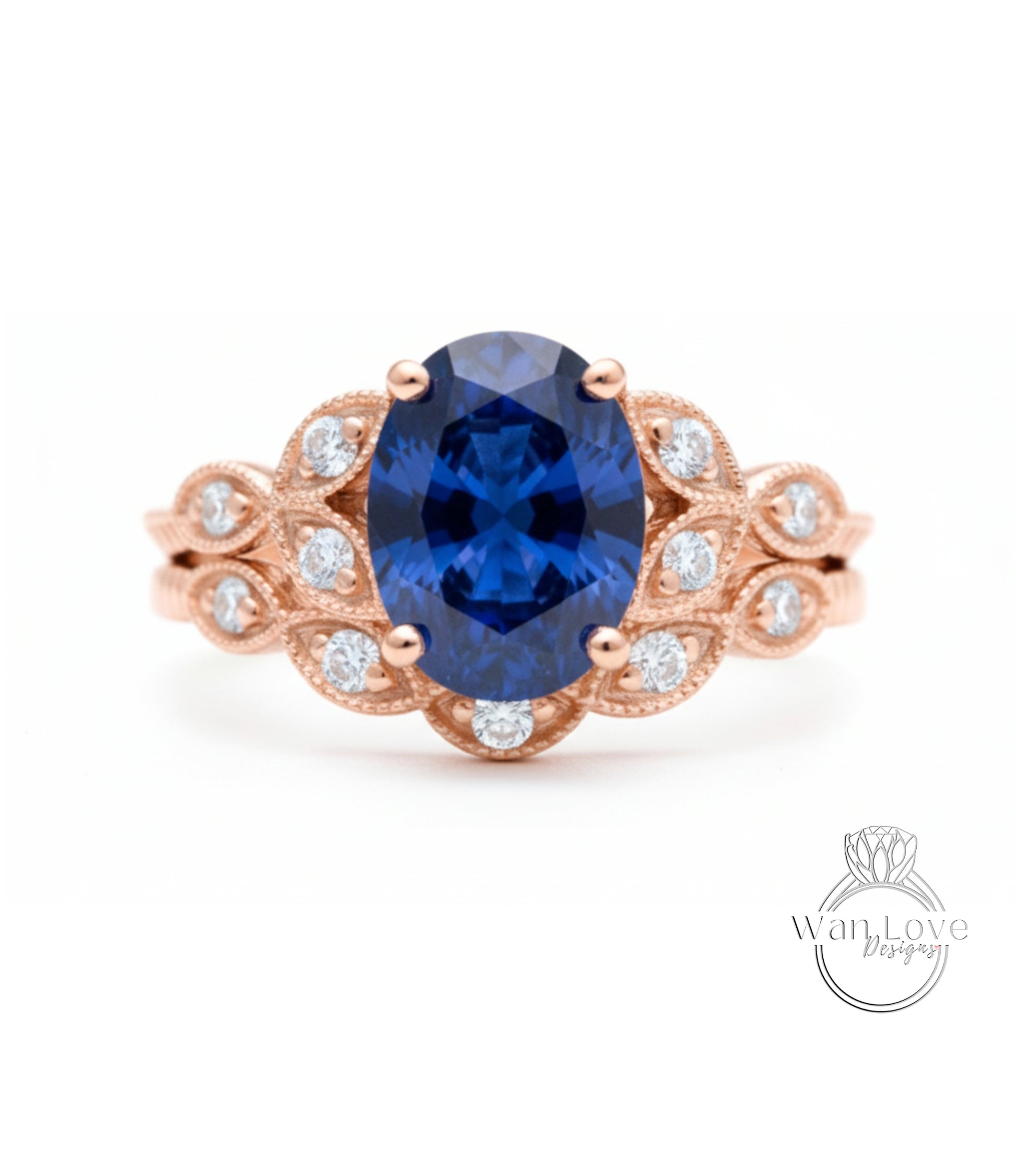 a beautiful blue sapphire engagement ring with a delicate rose gold band adorned with small diamonds.