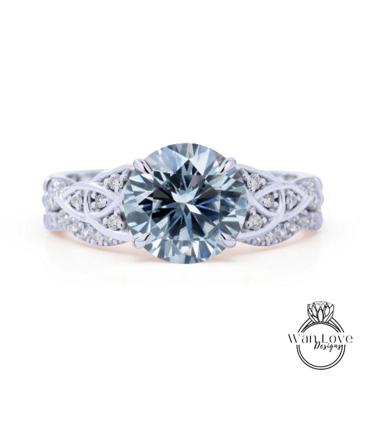 A stunning engagement ring with a large, brilliant blue diamond set in a silver band adorned with smaller diamonds.