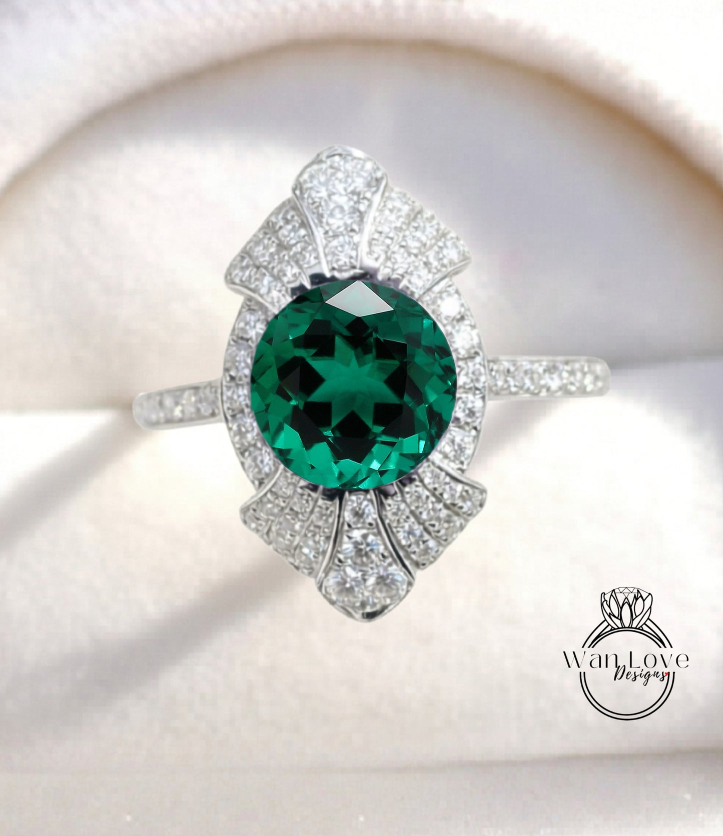 A close-up image of a diamond ring with a large, round green gemstone at the center, surrounded by smaller diamonds.