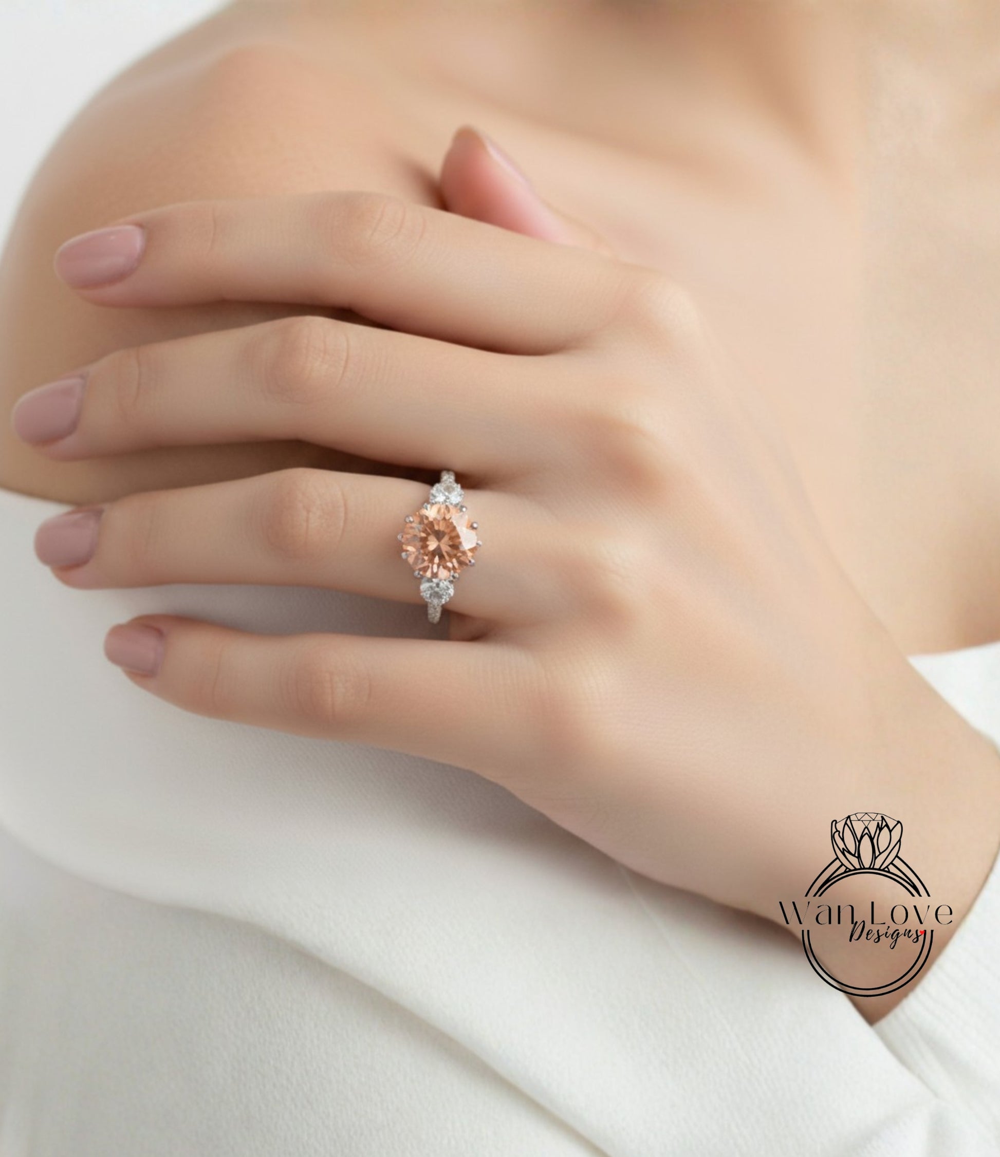 A close-up of a person's hand wearing a diamond engagement ring with a large central stone surrounded by smaller stones.
