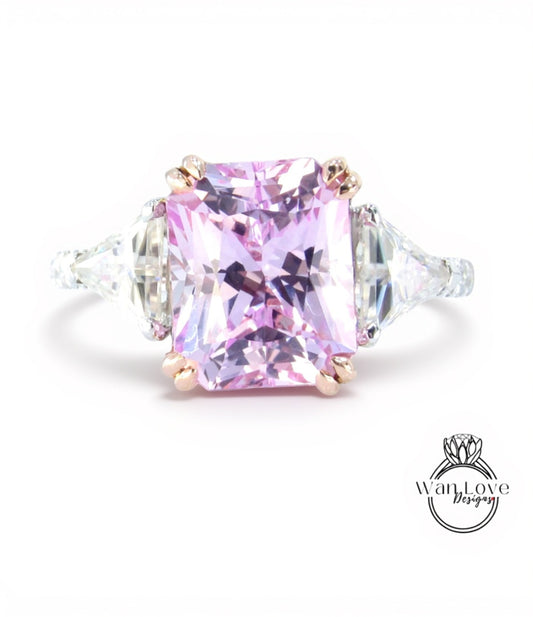 A large, pink gemstone ring with a diamond-encrusted band.