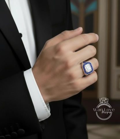 A close-up of a person's hand wearing a large, ornate ring with a blue gemstone.