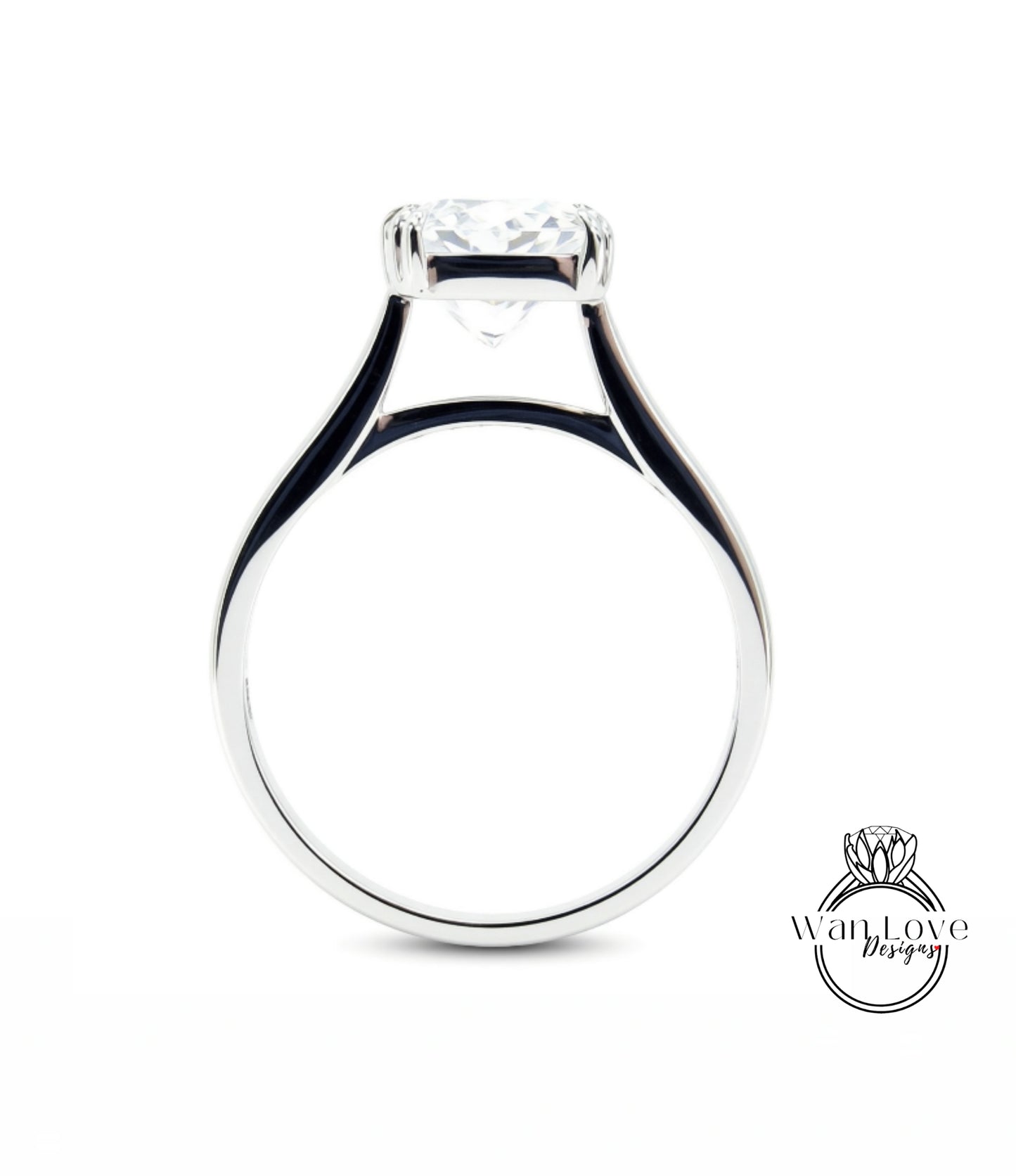 A silver engagement ring with a large central diamond.