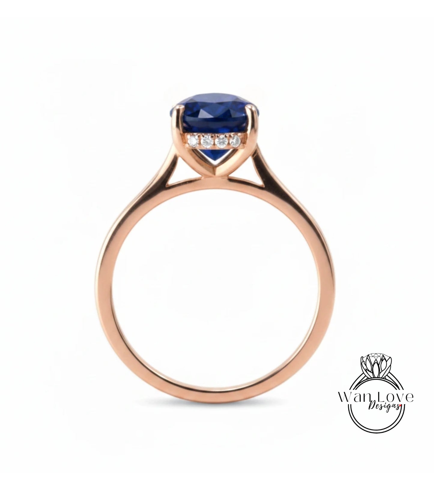 A rose gold engagement ring with a large blue gemstone set in the center.