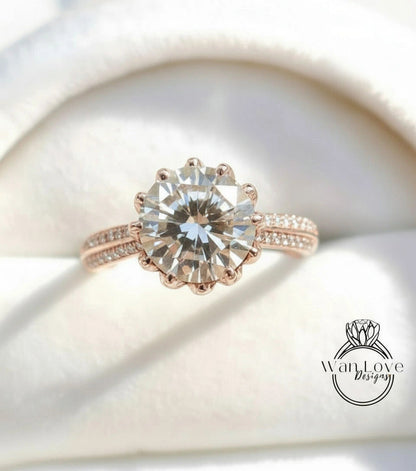 A close-up image of a beautiful engagement ring with a large, round diamond set in a rose gold band.