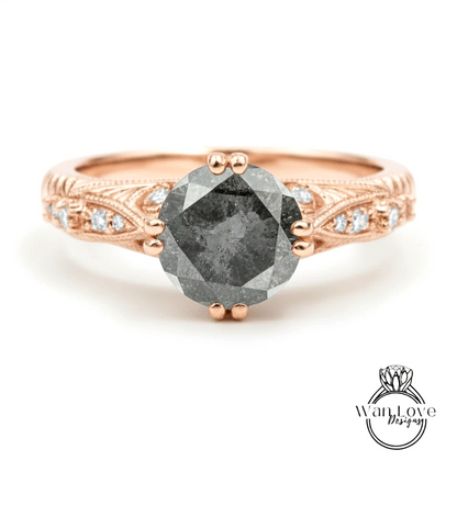 a rose gold engagement ring with a large, dark gray diamond as the centerpiece.