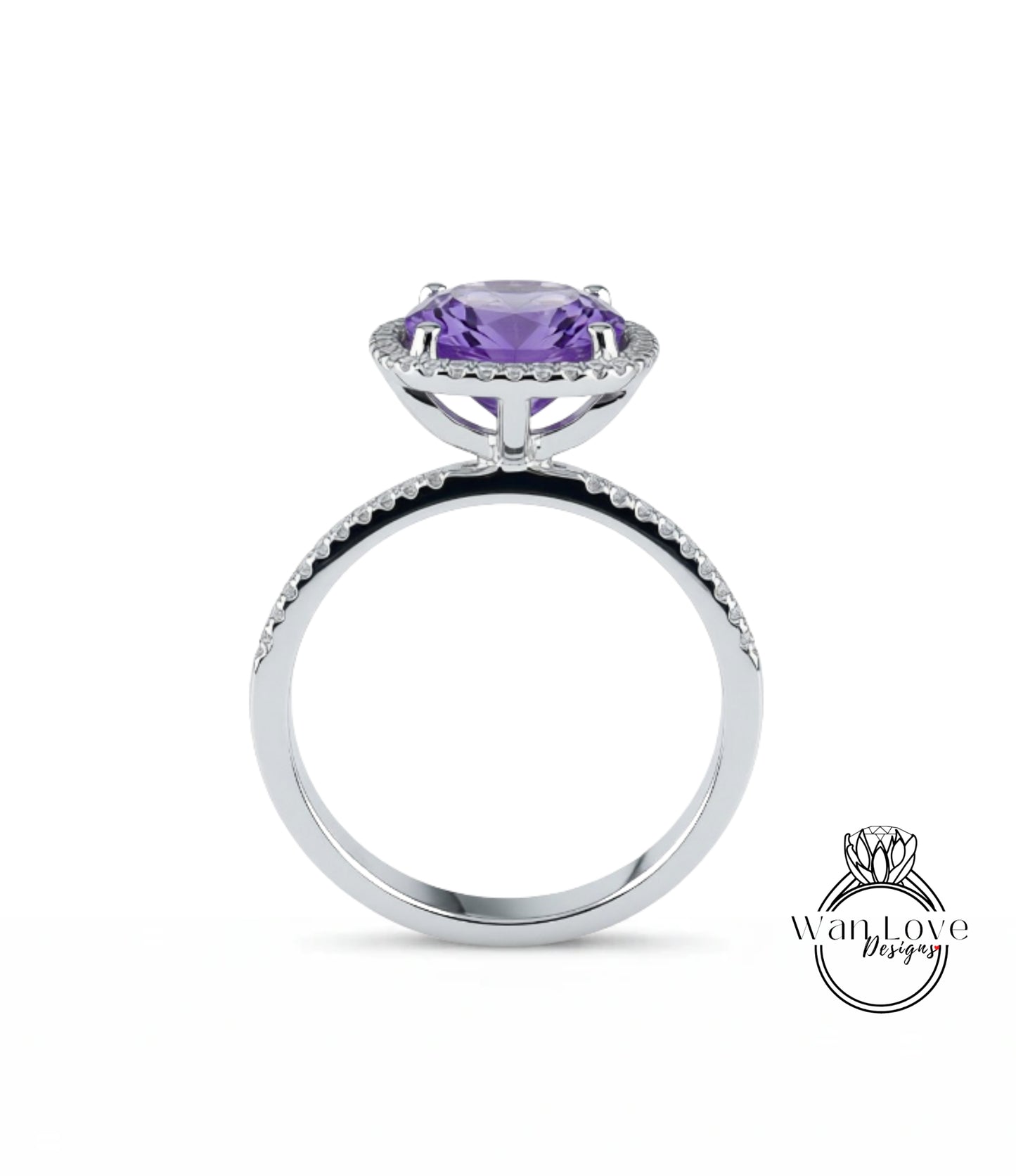 A silver ring with a large purple gemstone, likely an amethyst, set in a halo of smaller diamonds.