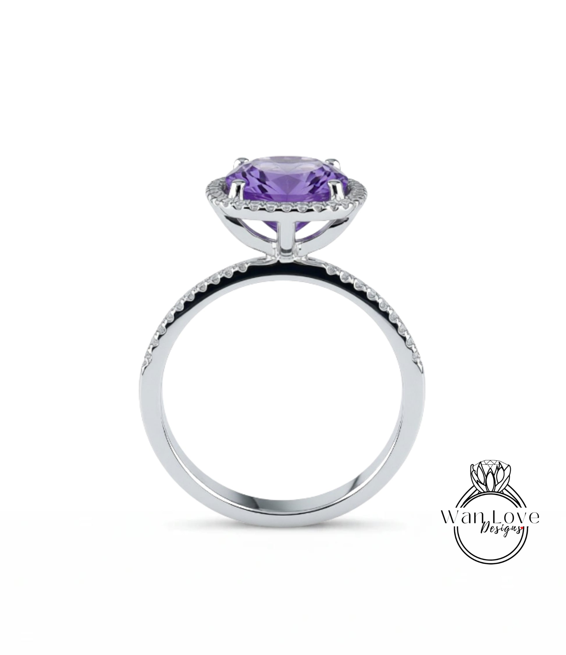 A silver ring with a large purple gemstone, likely an amethyst, set in a halo of smaller diamonds.