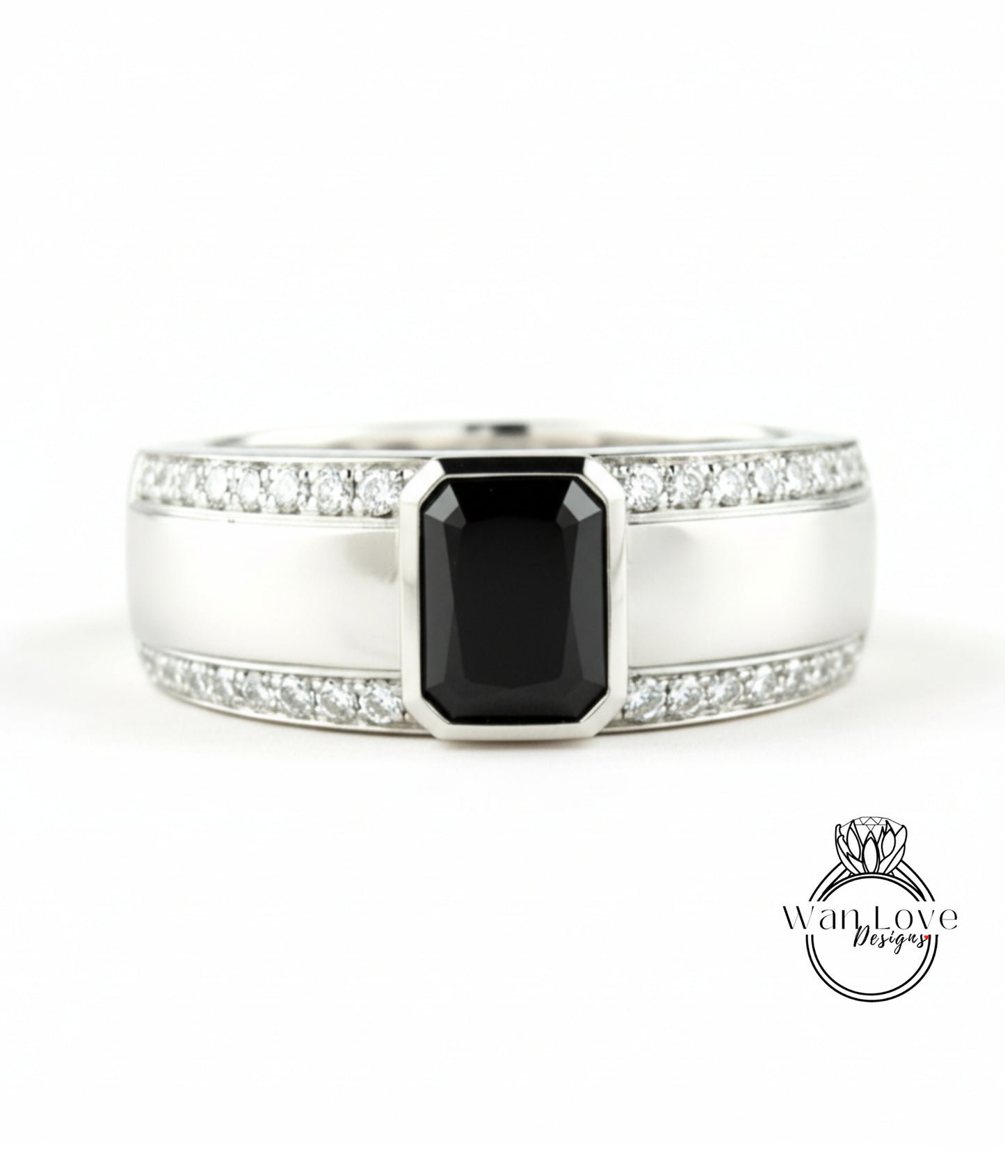 A silver ring with a large black gemstone in the center, surrounded by smaller diamonds.