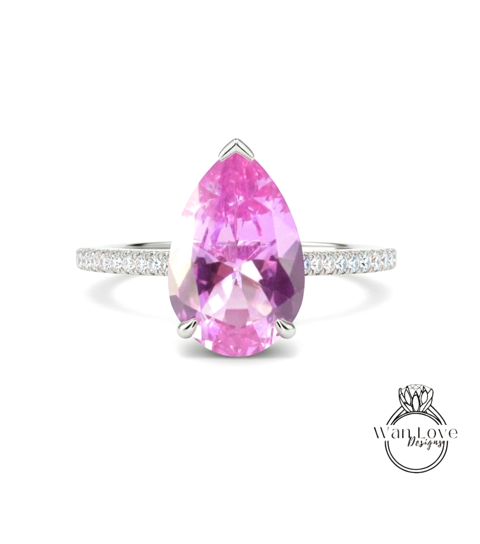 A ring featuring a large, pink gemstone set in a silver band.