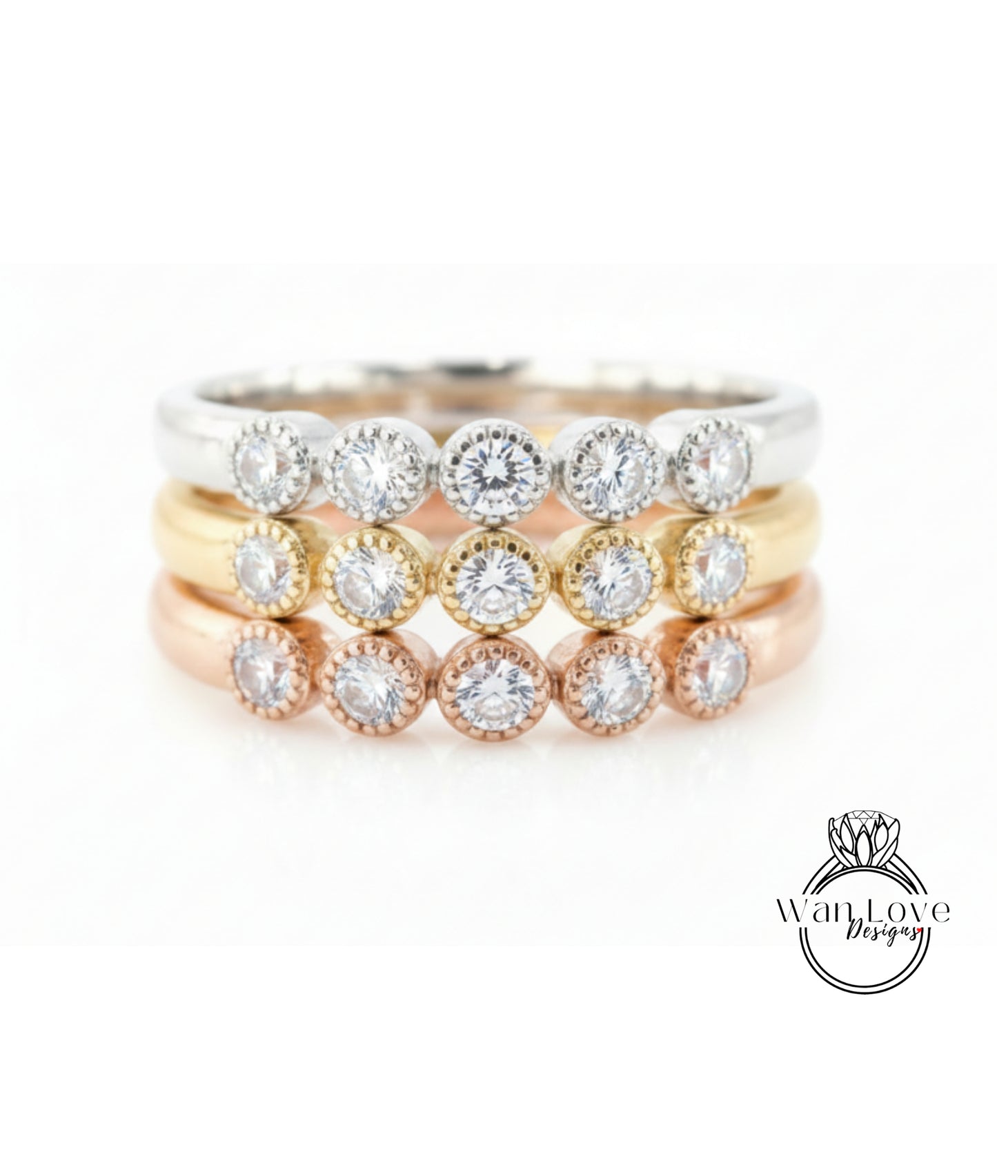 A ring with multiple tiers of rings, each ring featuring a diamond. The rings are arranged in a layered fashion, with the topmost ring being the largest and the bottommost ring being the smallest.