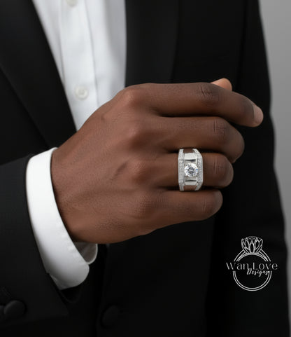 A close-up of a person's hand wearing a large diamond ring on the ring finger.