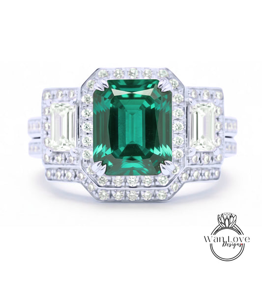 A stunning engagement ring with a large, vibrant green gemstone surrounded by smaller diamonds set in a halo of smaller diamonds.