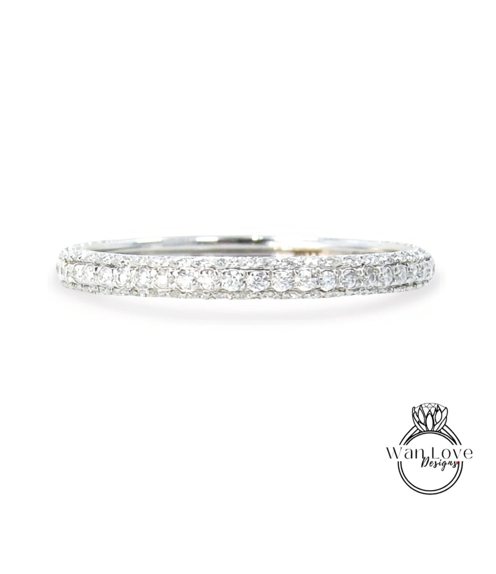 A diamond band ring with a row of clear diamonds set in a silver band.