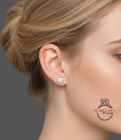 A close-up of a woman's face, focusing on her ear with a heart-shaped earring.
