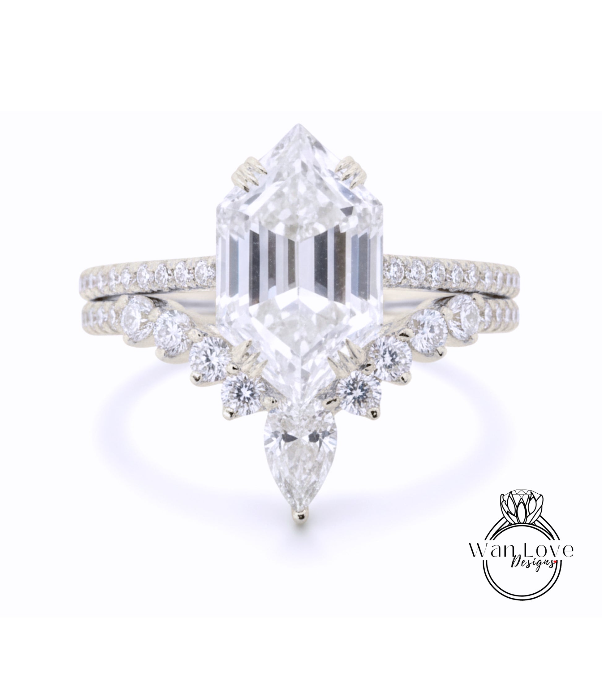 A stunning diamond engagement ring with a large, brilliant-cut diamond at the center, surrounded by smaller diamonds and pear-shaped stones. The ring is set in a silver band, and the background is a plain white color.