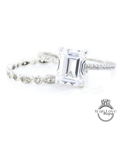 A close-up view of a diamond engagement ring with a large, clear gemstone set in a silver band.