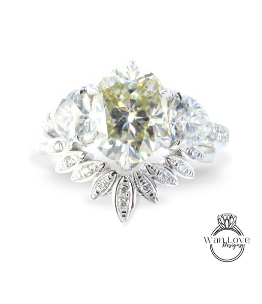 A stunning diamond engagement ring with a large central diamond surrounded by smaller diamonds and a delicate floral design.