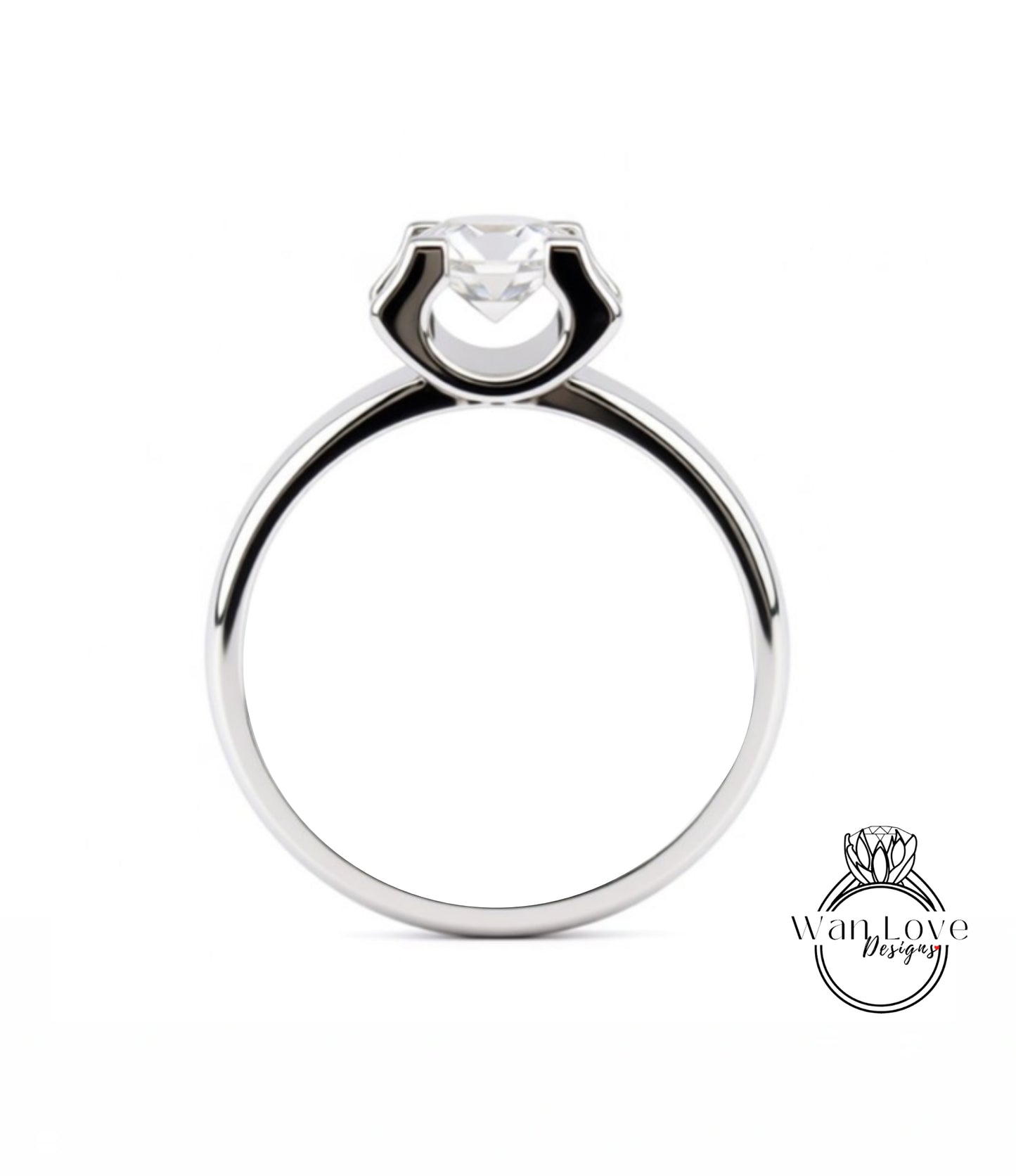 A silver engagement ring with a large central diamond.