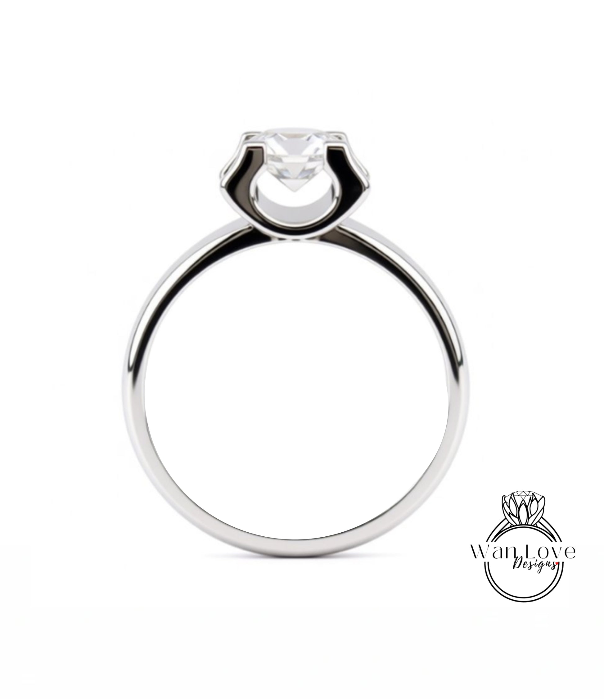 A silver engagement ring with a large central diamond.
