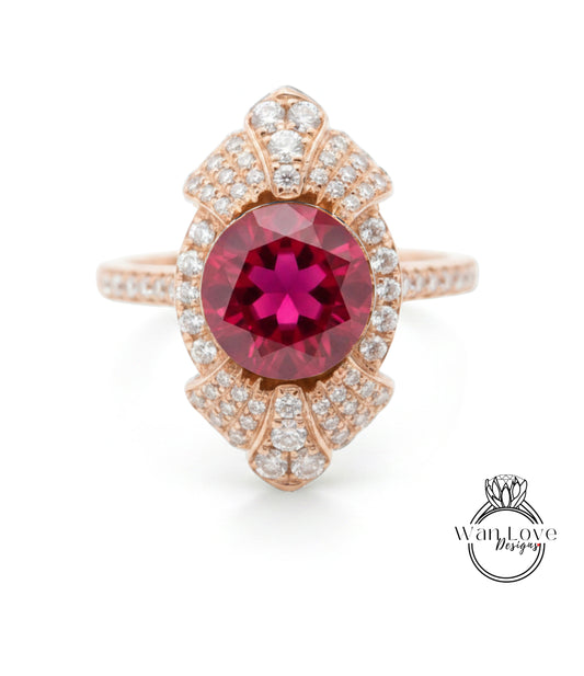 A stunning pink gemstone ring with a large central gemstone surrounded by smaller diamonds set in an intricate, ornate design.