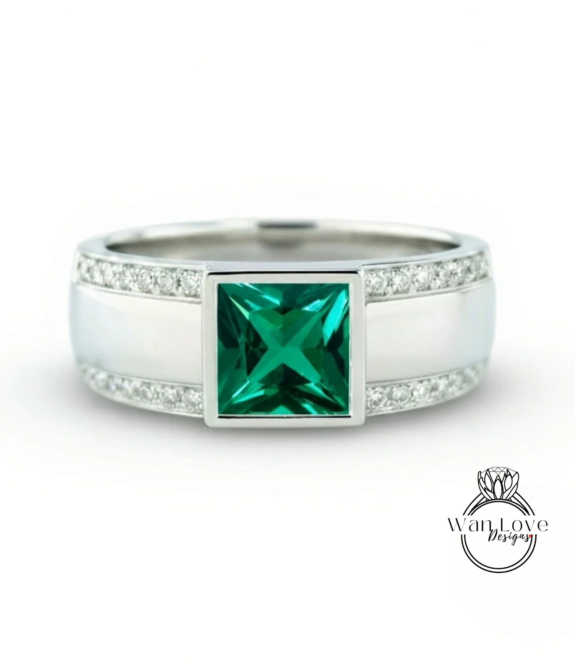 A silver ring with a large square emerald gemstone in the center, surrounded by smaller diamonds.