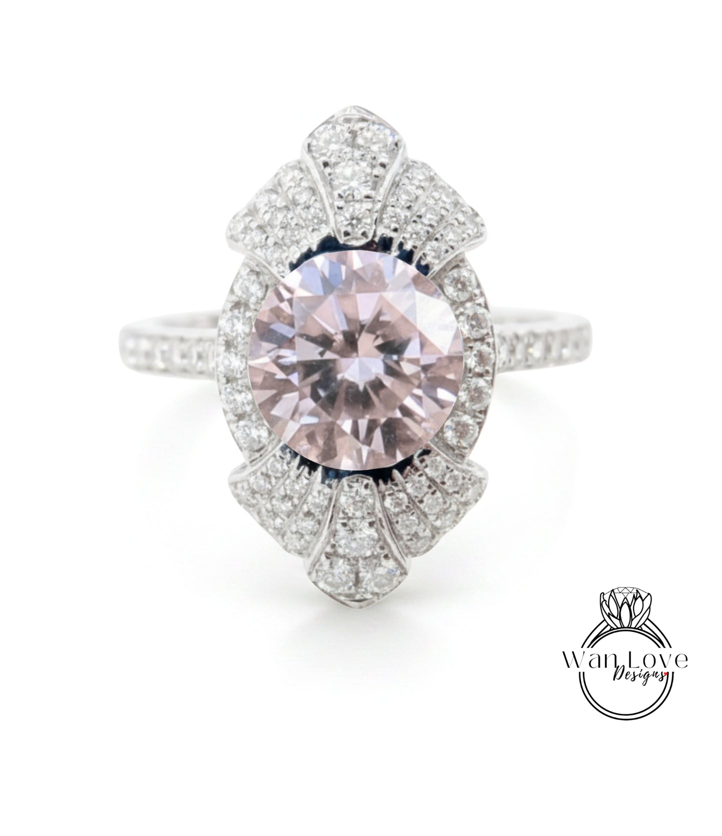 A stunning pink diamond ring with a large central gemstone surrounded by smaller diamonds, set in a silver band.
