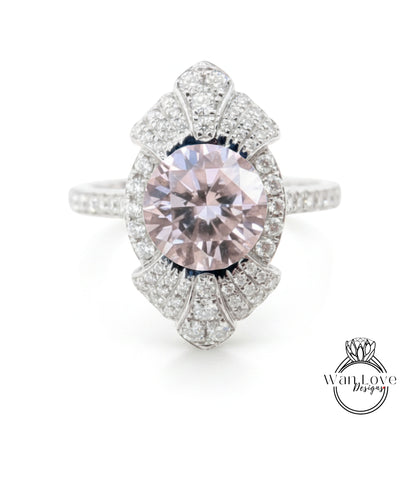 A stunning pink diamond ring with a large central gemstone surrounded by smaller diamonds, set in a silver band.