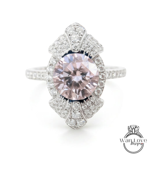 A stunning pink diamond ring with a large central gemstone surrounded by smaller diamonds, set in a silver band.