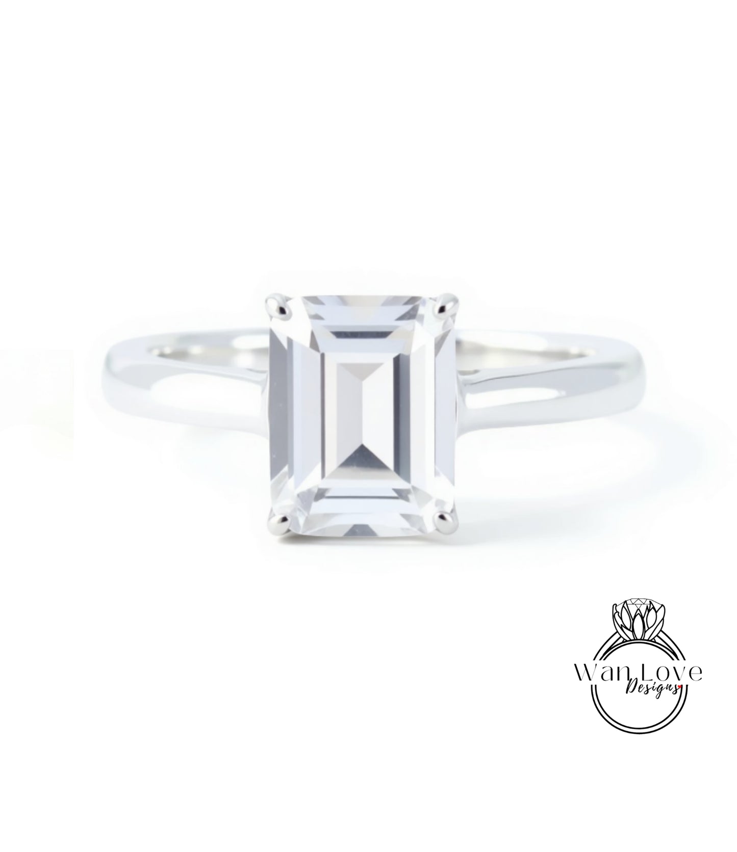 A diamond engagement ring with a large, clear gemstone set in a silver band.