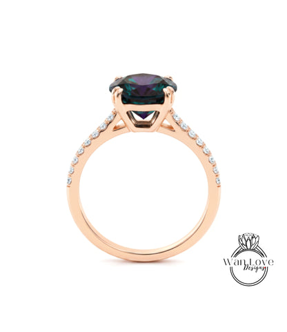 A gold ring with a large purple gemstone set in the center, surrounded by smaller diamonds.