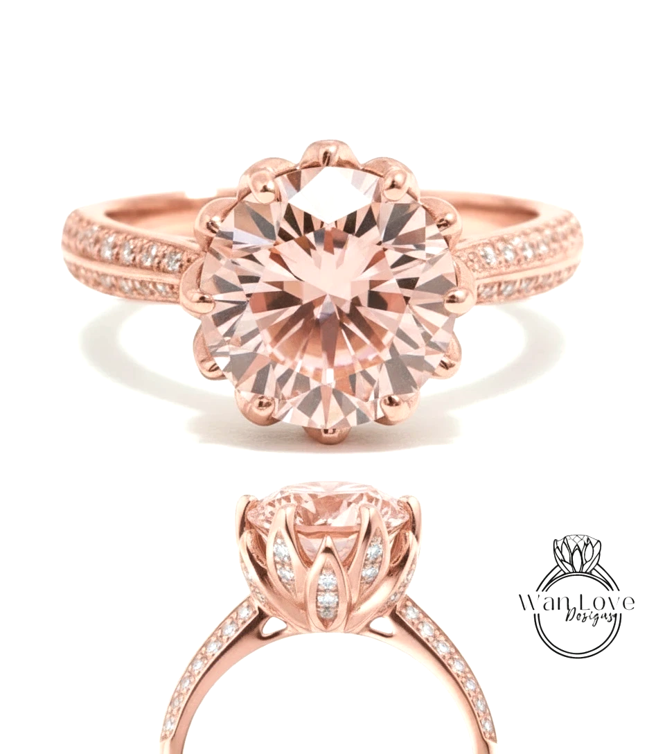 a beautiful pink diamond engagement ring with a large central diamond surrounded by smaller diamonds on the band.