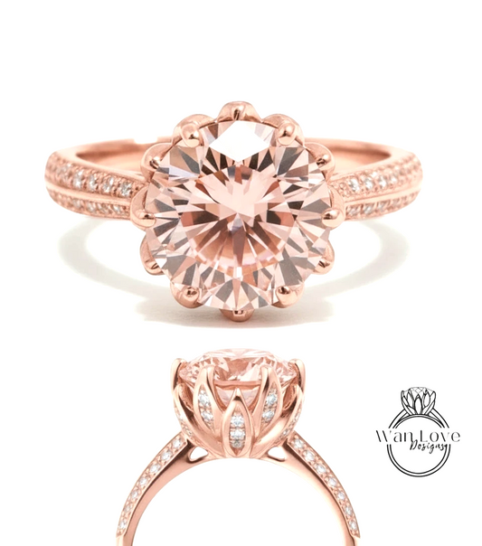 a beautiful pink diamond engagement ring with a large central diamond surrounded by smaller diamonds on the band.