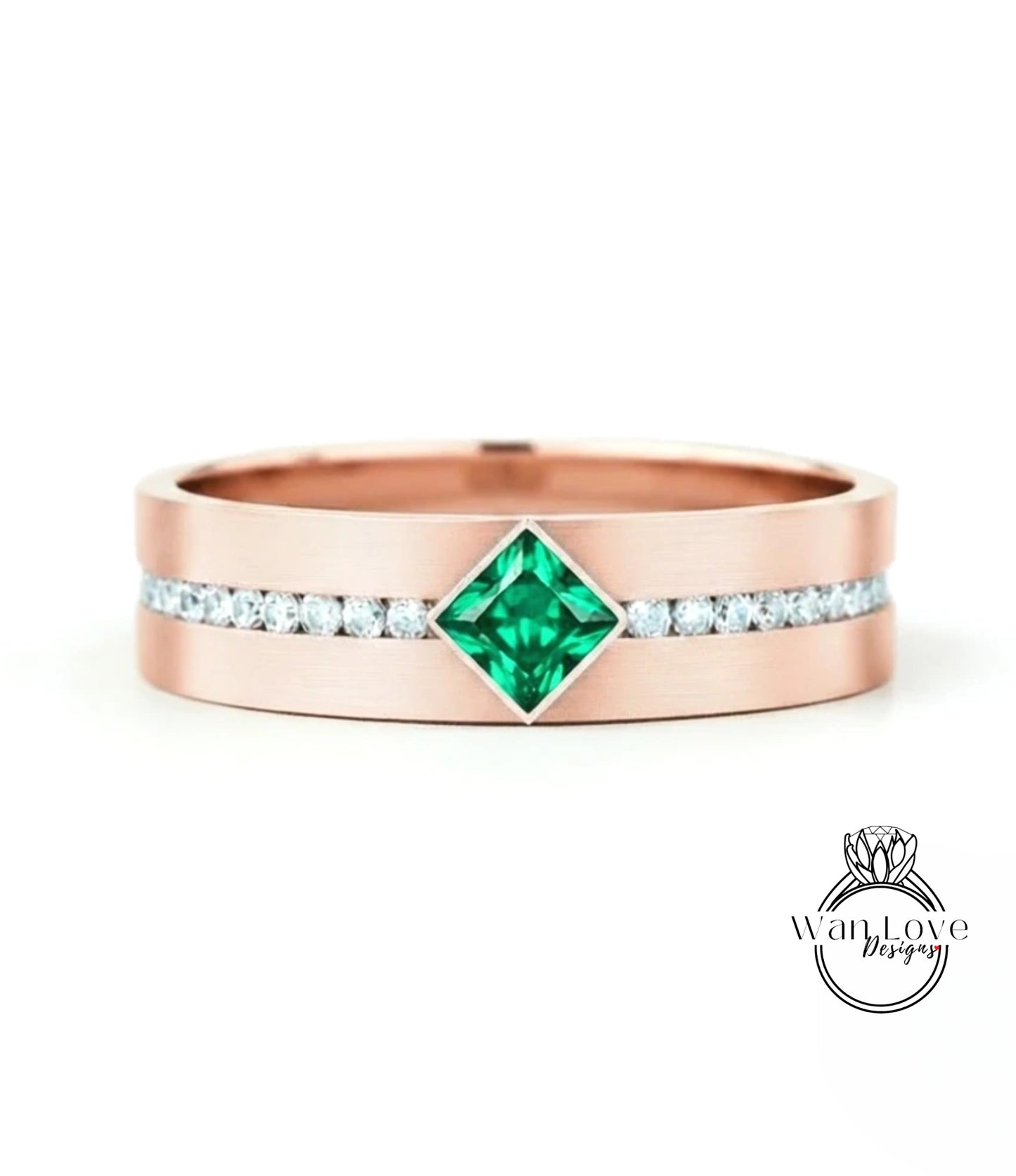 A rose gold ring with a large green gemstone in the center, surrounded by smaller diamonds.