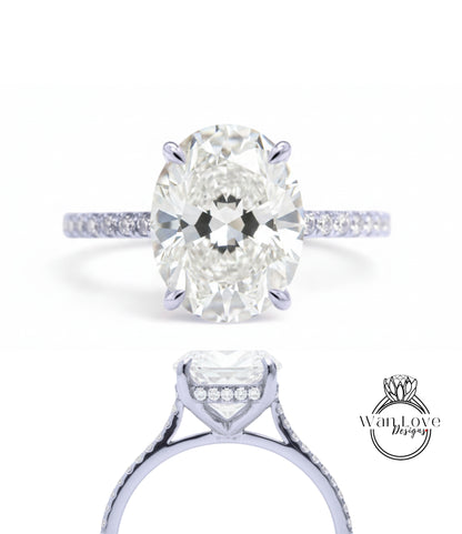 A close-up view of a diamond engagement ring with a large oval-shaped diamond set in a solitaire ring band.