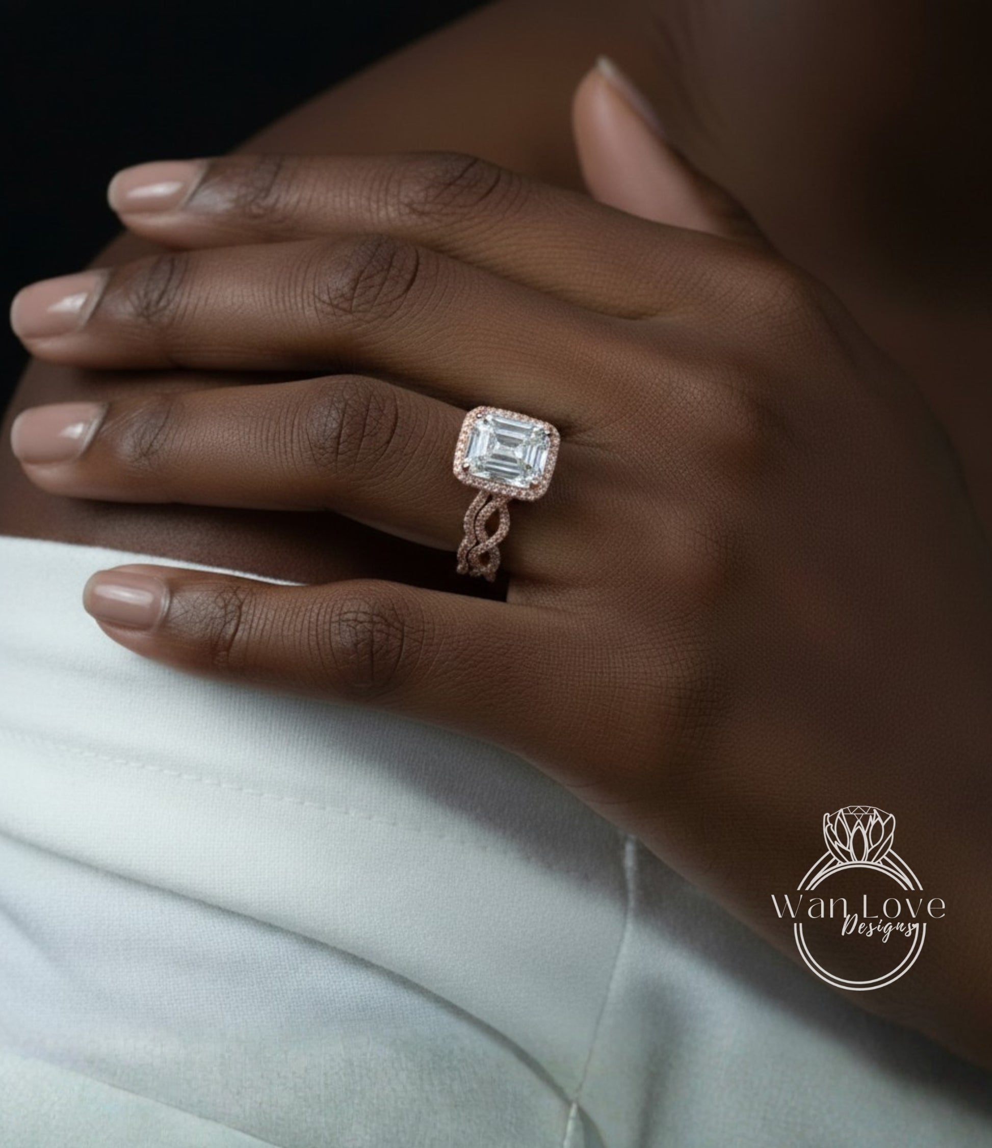 A close-up of a person's hand wearing a large, ornate engagement ring with a diamond center stone.