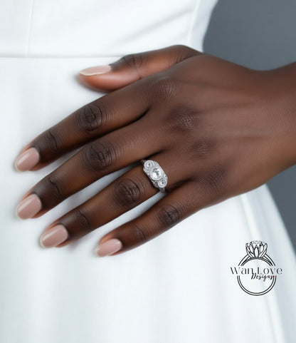 A close-up of a hand wearing a diamond engagement ring.