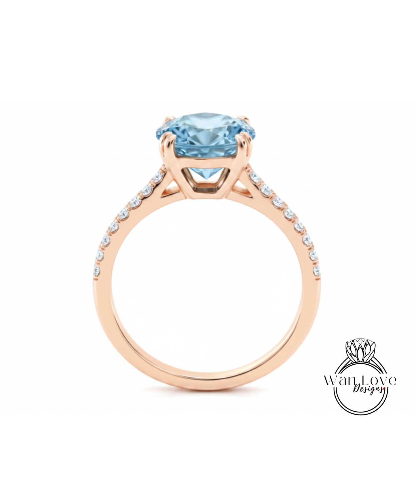 A gold ring with a large blue gemstone, likely a diamond, set in the center.