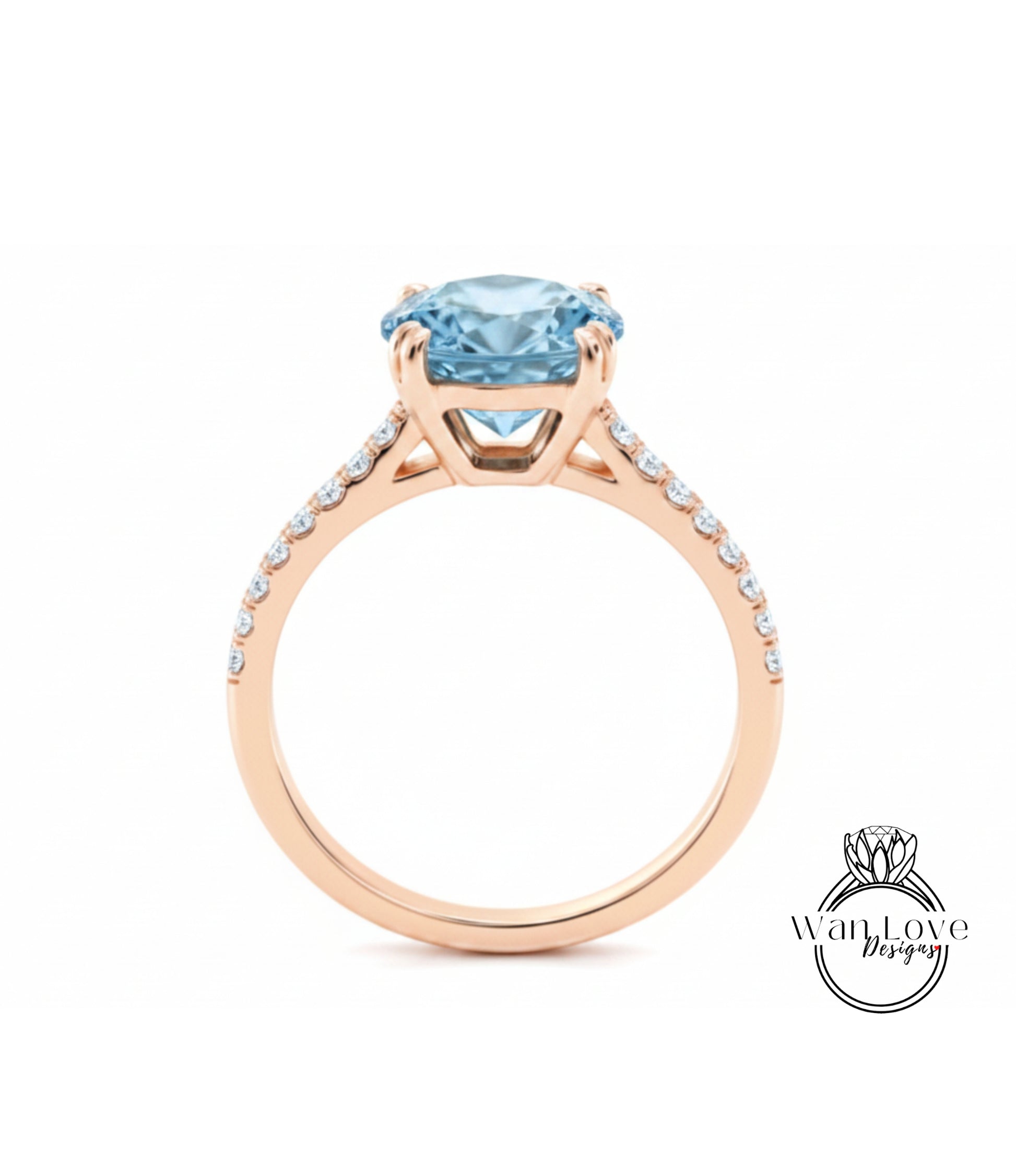 A gold ring with a large blue gemstone, likely a diamond, set in the center.