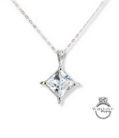 A necklace with a large, clear gemstone pendant.