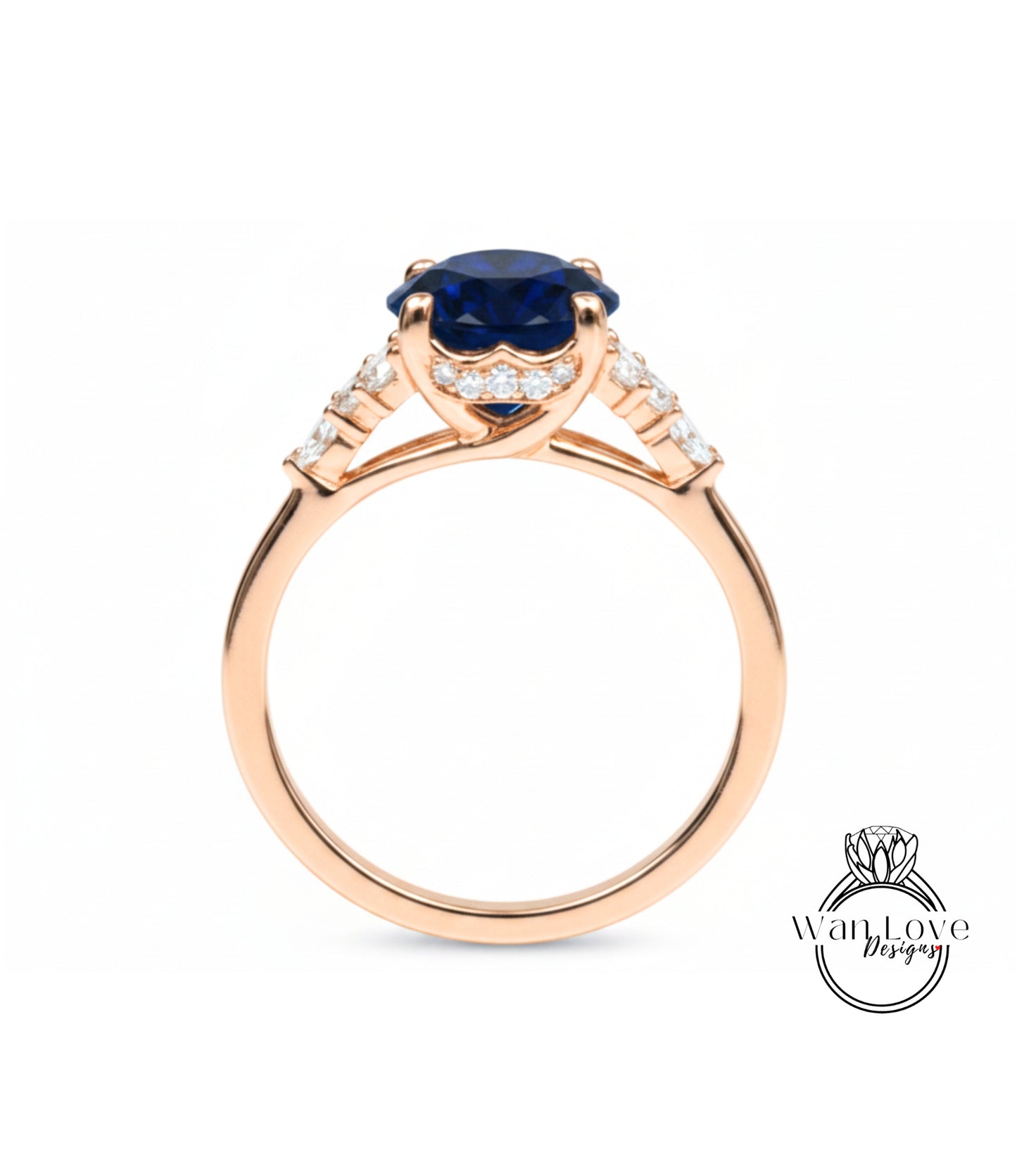 A gold ring with a large blue gemstone, possibly a sapphire, set in a halo of smaller diamonds.