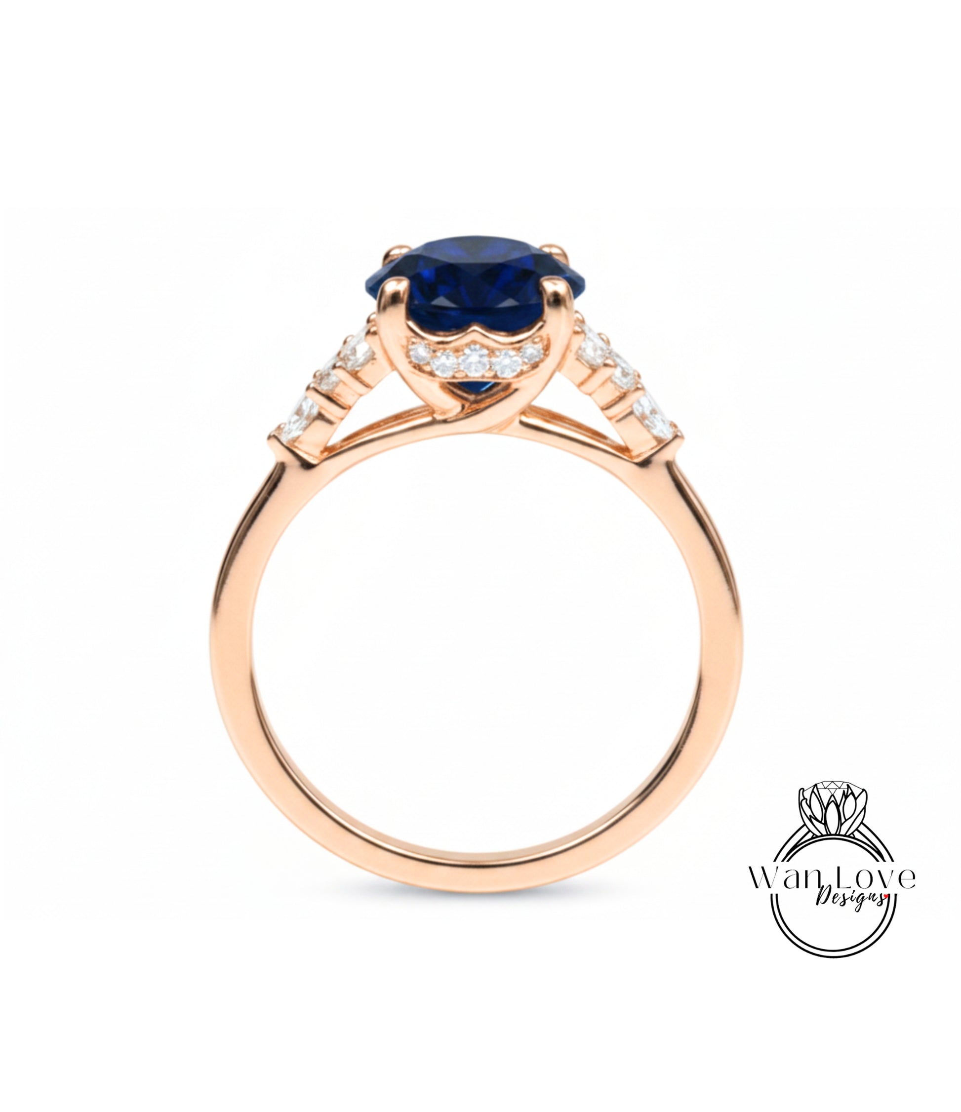 A gold ring with a large blue gemstone, possibly a sapphire, set in a halo of smaller diamonds.