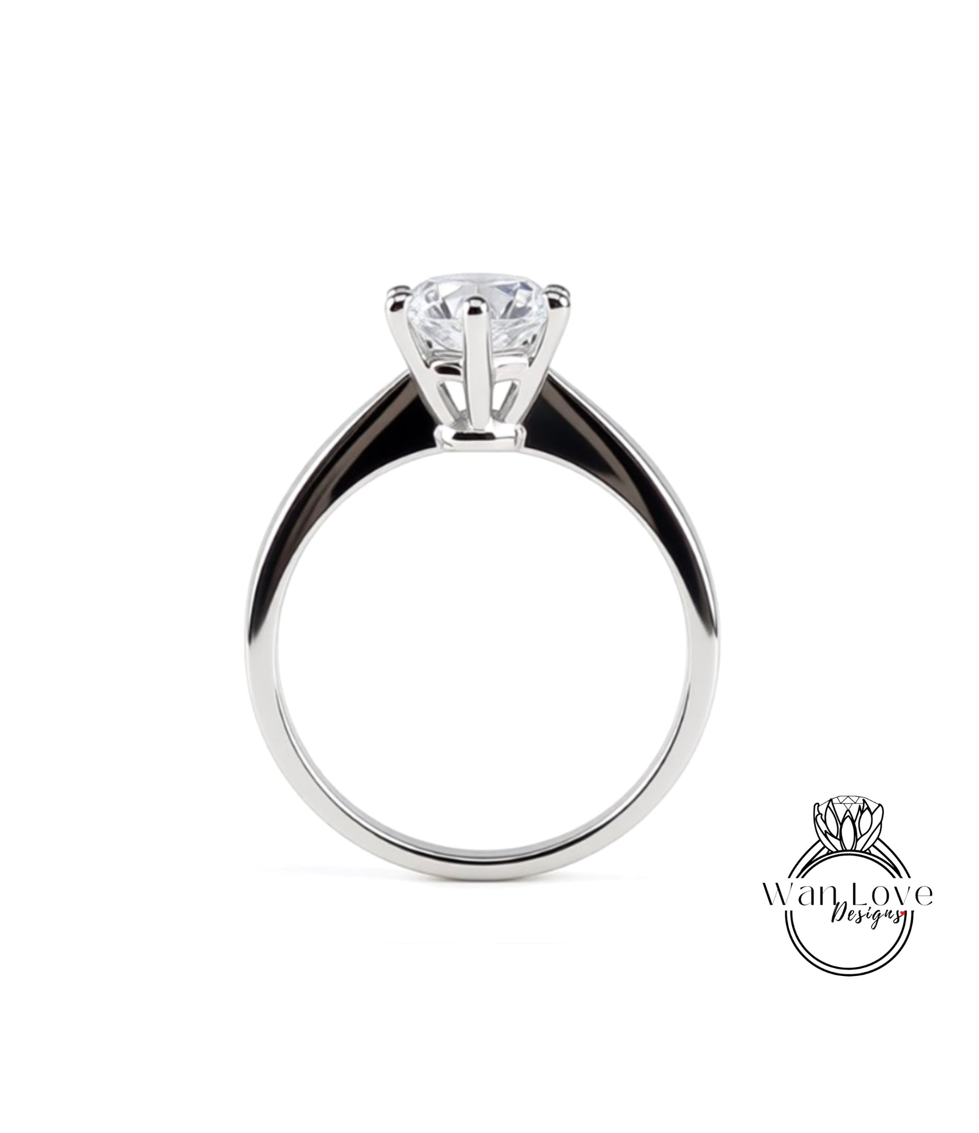 A silver engagement ring with a large central diamond and a smaller diamond on the band.